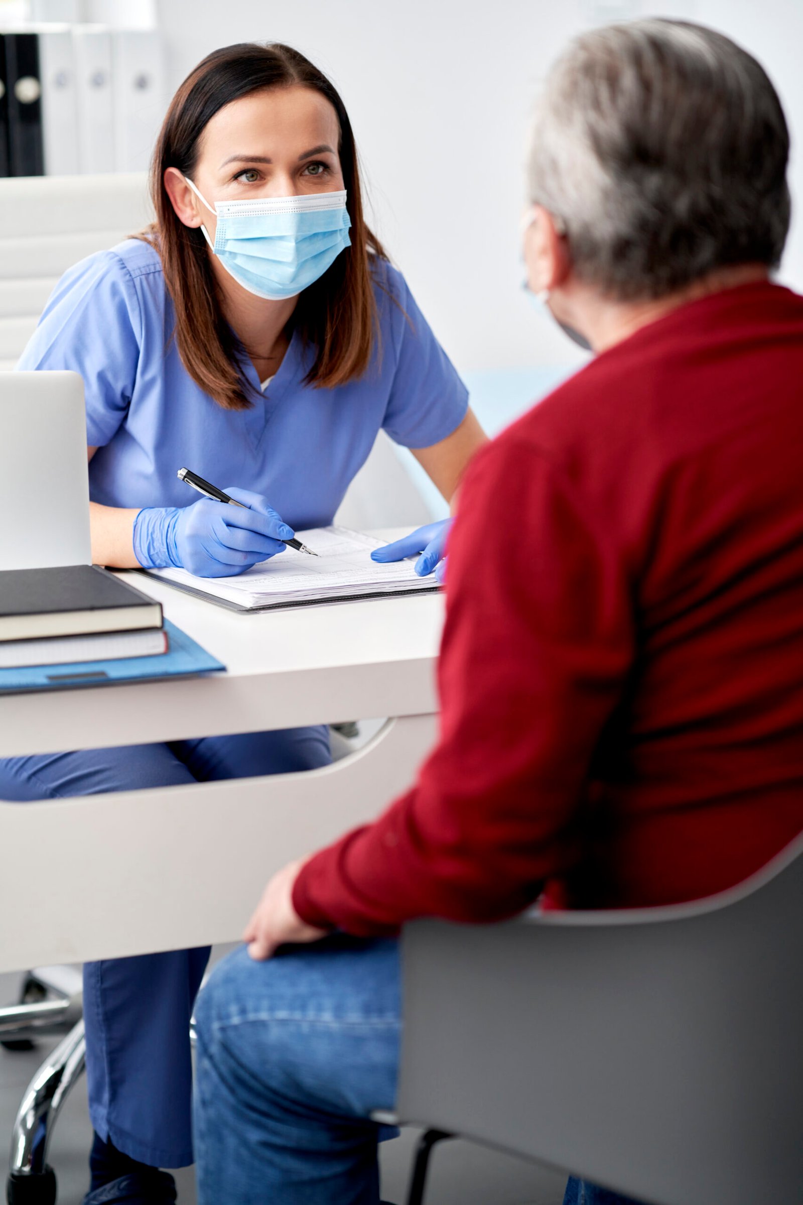 female doctor conducts a medical interview with the senior patient 1 1 scaled